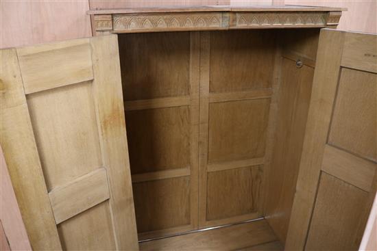 A five piece carved oak bedroom suite